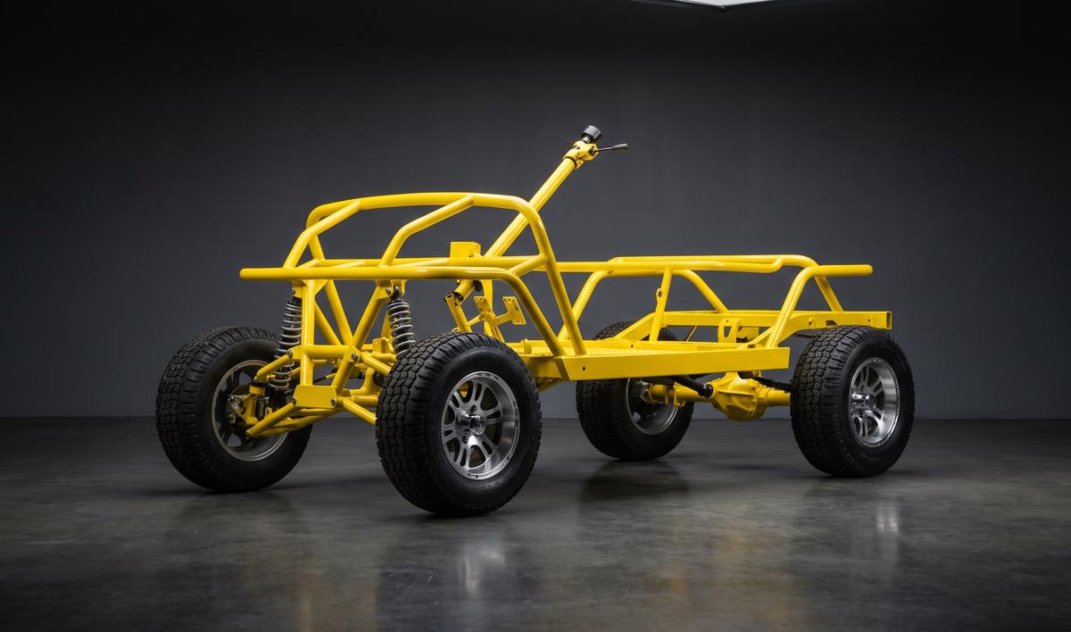 Bare golf cart rolling chassis powder coated in gloss safety yellow with no body panels